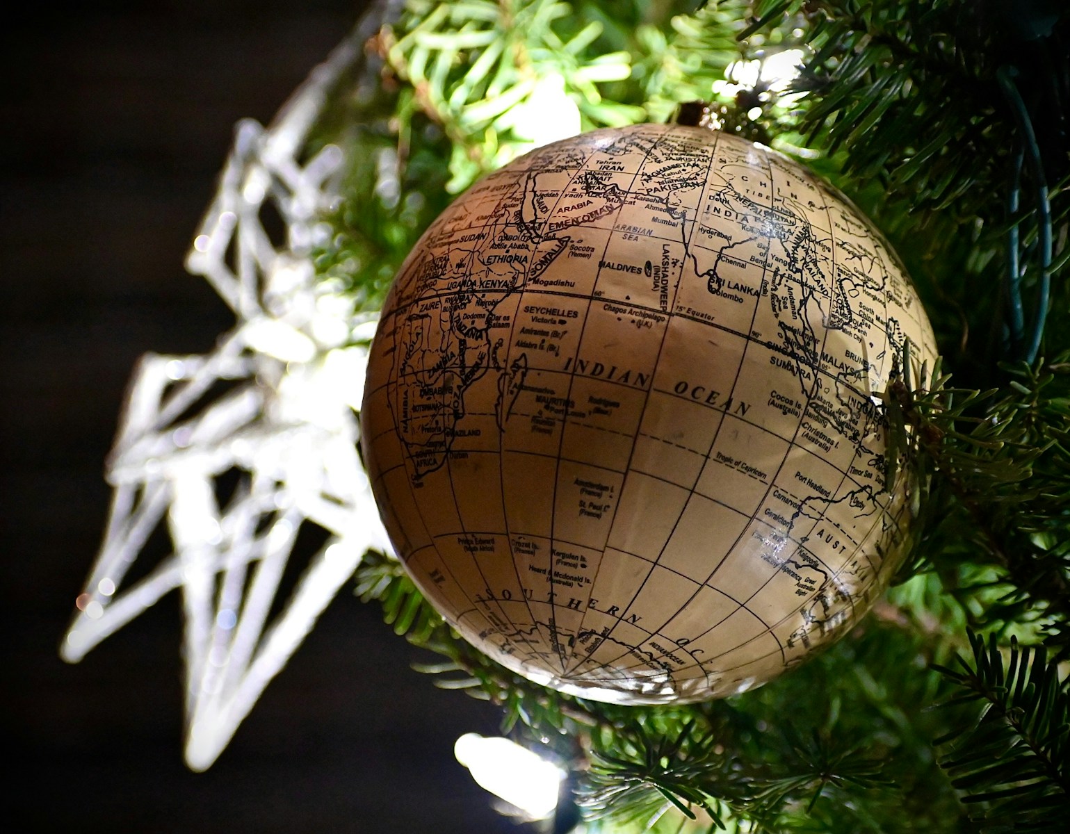 a close up of a christmas ornament on a tree